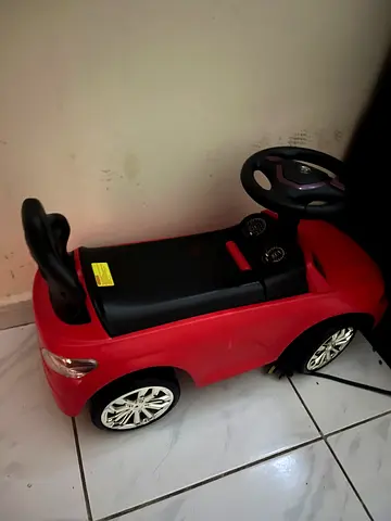 Red Ride-On Kids Car Toy with Steering Wheel - Good Condition