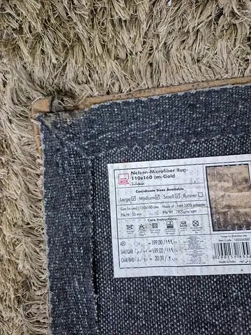 Beige shaggy area rug - good used condition 110cm x 160cm