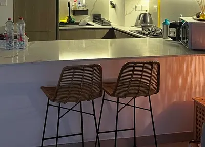 Pair of rattan bar stools with metal legs - used, good condition