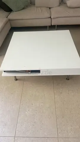 White square coffee table with storage drawer. Little detail in surface