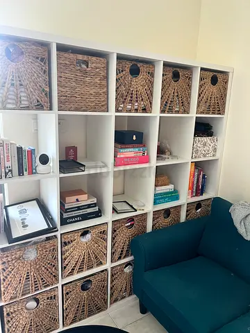 Large white shelving unit with 25 cubes