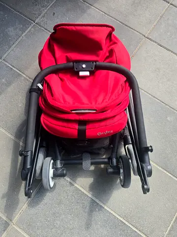 Compact red baby stroller (foldable) - good condition