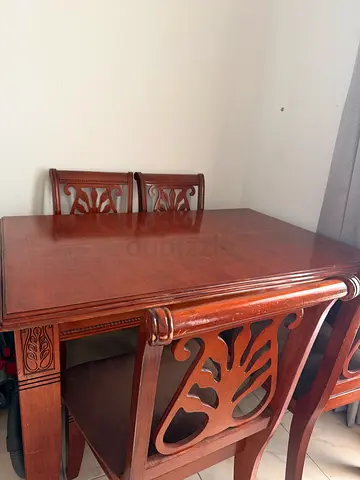 Solid Wood Dining Table with Carved Chairs – Good Condition
