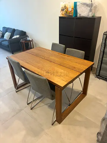 Solid Wood Dining Table ( condition excellent) with 4 Grey Chairs ( fabric)