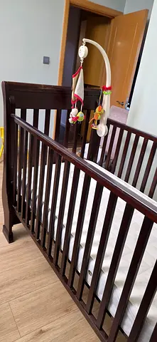 Pottery and barn dark wood baby crib with waterproof covering of spring mattress - good condition