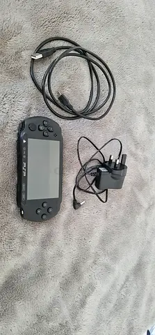 Modded Sony PSP handheld console with charger and AV cable - good working condition