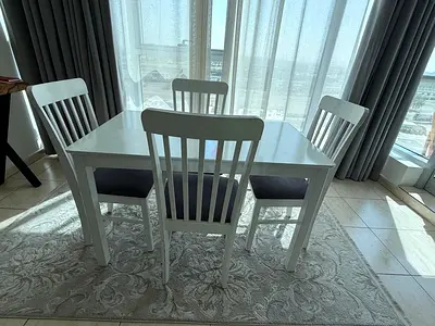 White Wooden 4-Seater Dining Table with Cushioned Chairs