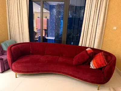 Curved Burgundy Velvet 4-Seater Sofa with Gold Legs and two single seater sofa