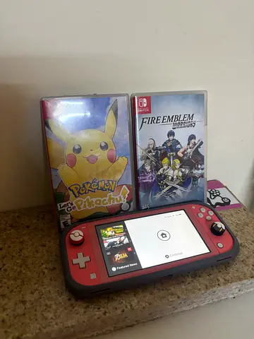 Nintendo Switch Lite with 2 Games (Pokémon: Lets Go Pikachu  Fire Emblem)