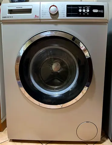 Hoover front-load washing machine is available for sale.