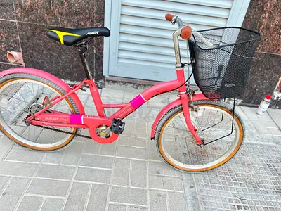 Pink small city/childrens bicycle with front basket