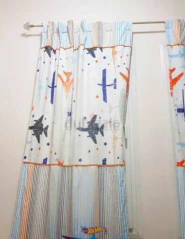 Pair of Home Centre kids curtains for Aed 150