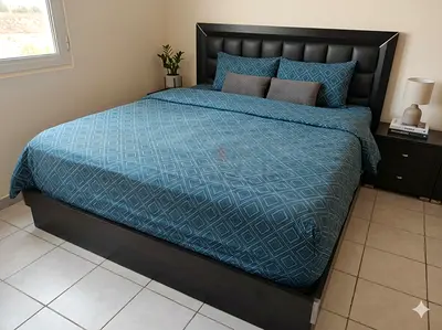 King leather-look bed frame with headboard and mattress included