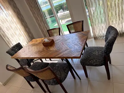 Solid Wood Dining Table with 6 Fabric and Ratan Chairs - Good Condition