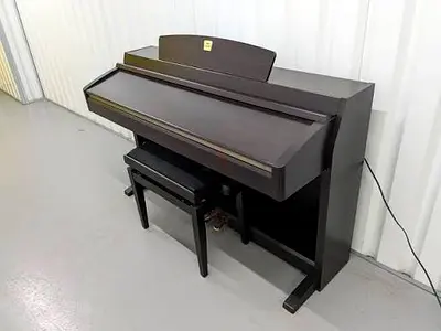 Yamaha Clavinova Clp230 Dark color Having minor scratches. With piano bench. Perfect working.