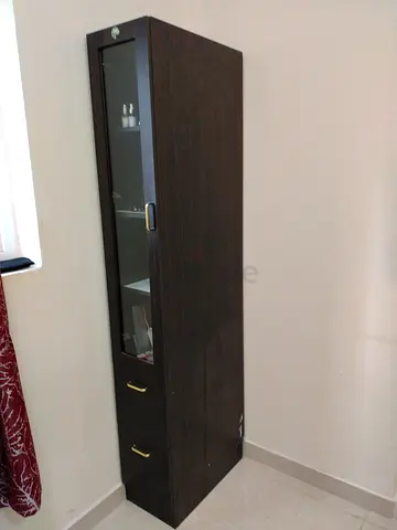 Slim tall display cabinet with glass door and two drawers - dark wood