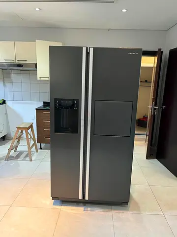 Spacious Side-by-Side Stainless Refrigerator - Good Working Condition