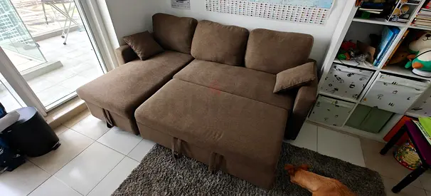 Brown fold-out sofa sleeper for two