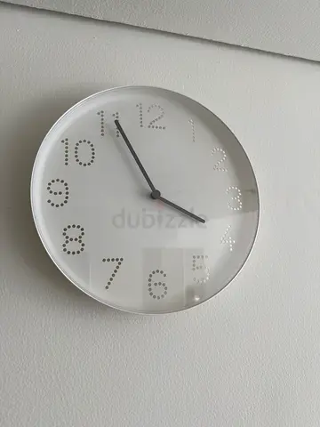 Simple white wall clock with dotted numerals