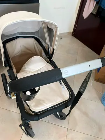 Lightweight beige baby stroller in good condition
