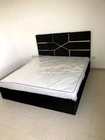 Queen size upholstered bed frame with decorative headboard - black