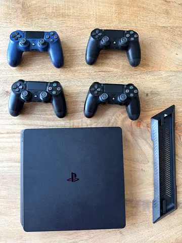 Sony PlayStation 4 Slim 1TB with 4  DualShock Controller And Best Games And Dual Charging Dock