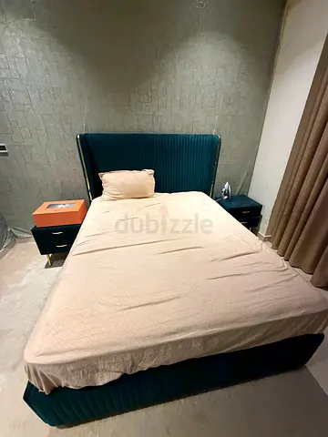 Queen bed frame with upholstered headboard and base. comes with Englander ortho mattress.
