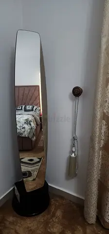 Elegant Rotating full length mirror with hidden storage shelves and drawer.