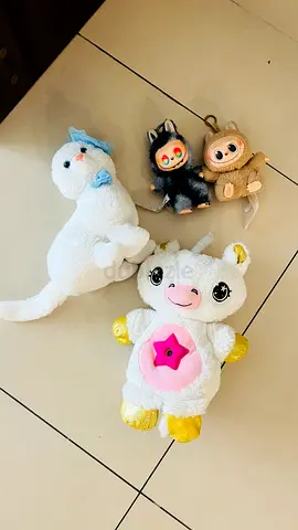 Assorted plush toys bundle — unicorn, seal and two small keychain dolls fixed price 25 AED for all