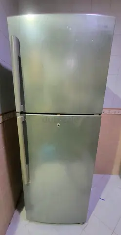 Silver double-door refrigerator - good working condition