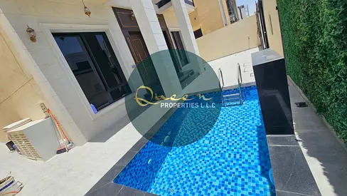 Luxury villa for sale in Al Yasmeen Ajman with modern finishing private swimming pool five master bedrooms majlis living room equipped kitchen maid ro