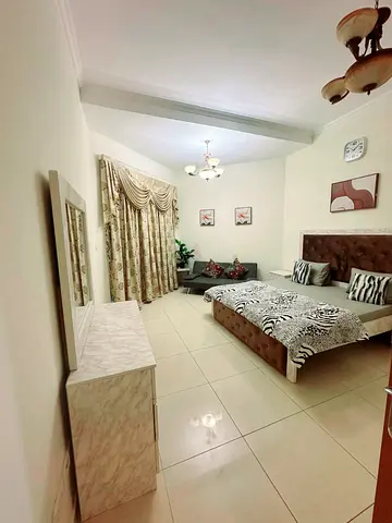 Family room with attached balcony and shared washroom