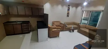 Two bedrooms and a living room for annual rent, unfurnished, in Ajman, City Towers, opposite Grand M