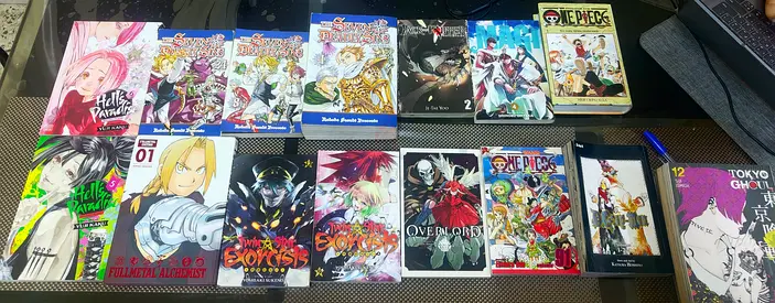 Collection of Manga Volumes — One Piece, Fullmetal, Tokyo Ghoul  More