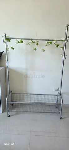 Metal garment rack with wheels and shoe shelf - used