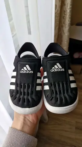 Gently used black Adidas kids slip-on sandals, size not specified
