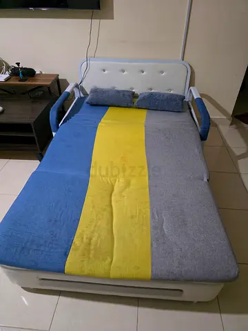 Compact 2-seater sofa bed with storage — blue/yellow/grey fabric