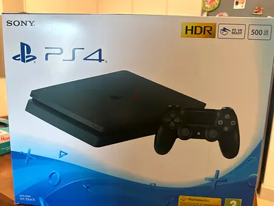 Sony PS4 Slim 500GB  - Good condition 2 original controller remotes with 7 premium games