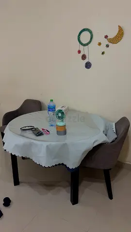 Small round dining table with 4 upholstered chairs with extend the table upto 8 people