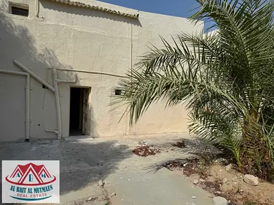 Two-bedroom house with separate entrance and hallway in Al Ghafiya