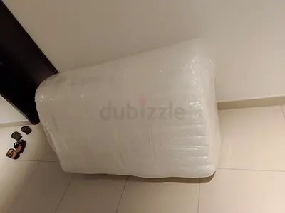 Queen mattress wrapped and ready for pickup