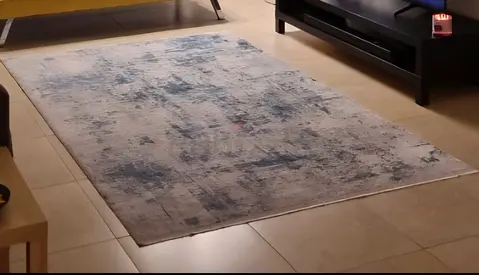 Used modern abstract area rug - light grey with blue accents, 5x8ft (approx)