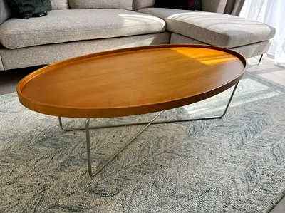 Oval shaped Wooden coffee table with metal legs