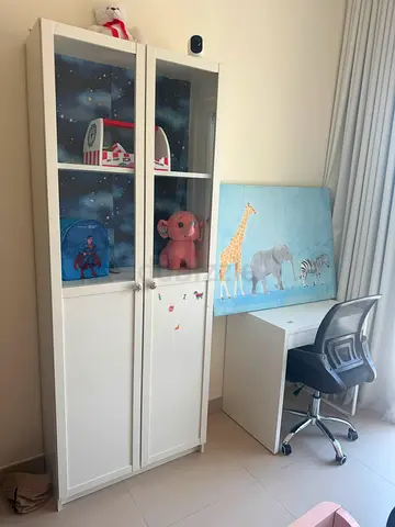 White display cabinet with desk and chair
