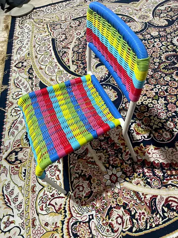 Set of 2 colorful woven metal patio chairs - good condition