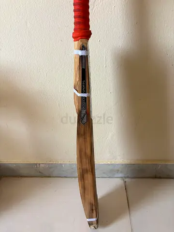 Used scoop cricket bat with grip - good condition
