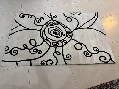 Light grey and black swirl patterned area rug - good condition