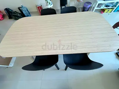 IKEA Dining Table with Four Black Chairs .