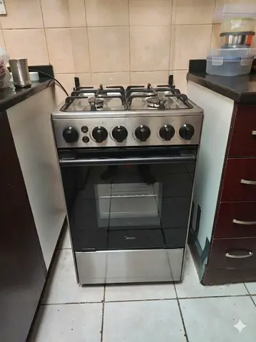 Midea 4-Burner Gas Cooker with Oven - Good Working Condition 60x60