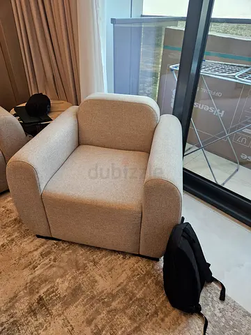 Brand new beige lounge chair...modern, excellent condition with no stains